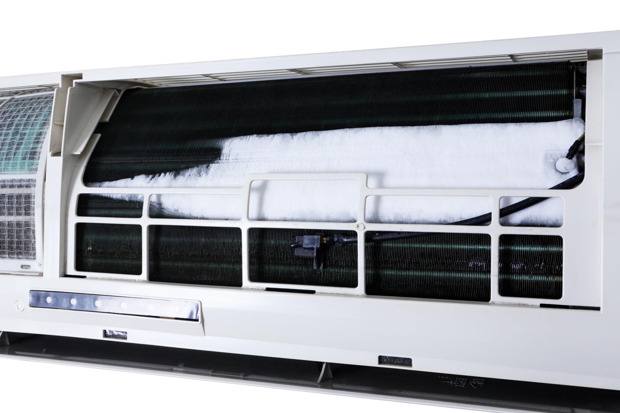 Air conditioner running but not cooling showing frozen coil and dirty air filter example